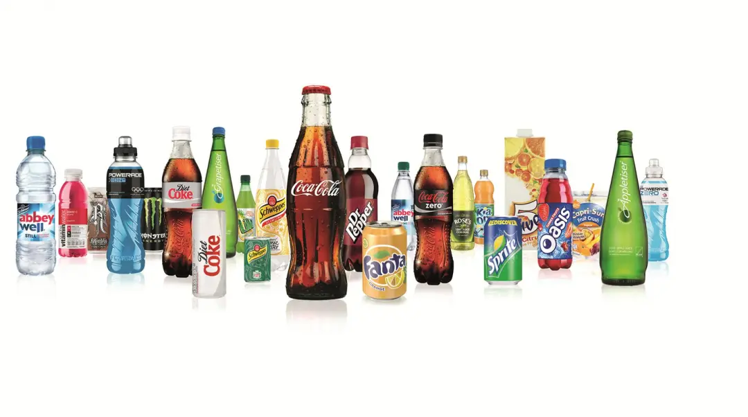 Range of Coca-Cola drinks in bottles and cans, including Diet Coke, Fanta, Sprite, Oasis and Appletiser